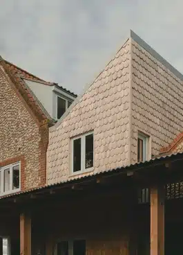 Cedar scalloped shingles extension with monopitch Alexander Hills Architects