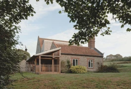 View of the veranda, extension, and house from the garden to the south Alexander Hills Architects