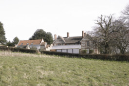 Long view of Old Rectory Farm from across the fields Alexander Hills Architects